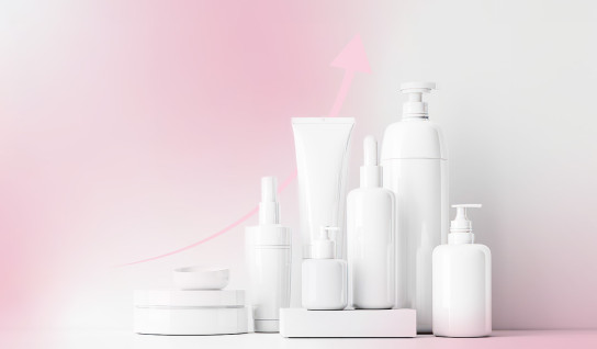 White bottles of cosmetics without branding, with a pink graph arrow rising up behind them